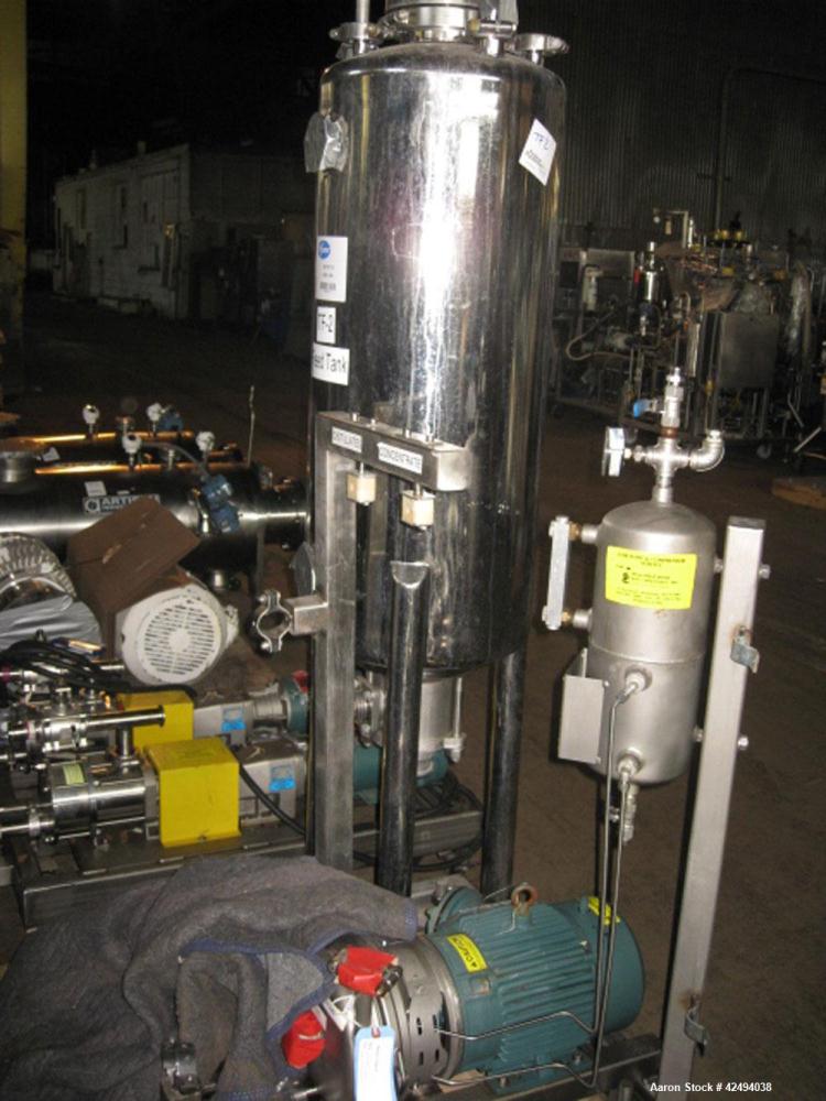 Used Artisan Rotoherm evaporation system, consisting of One 5 sq ft surface area Artisan Rototherm counter-curent evaporator, 316L stainless steel construction, approximately 18" diameter x 48" long ...