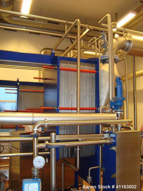 Used APV 2 Stage Evaporator, Capacity Approximately 4400 lbs/hr (2000 Kg/hr) finished product consisting of: (2) APV evaporators 29.25” diameter x 46.8” straight side (750 mm diameter x 1200 mm strai...