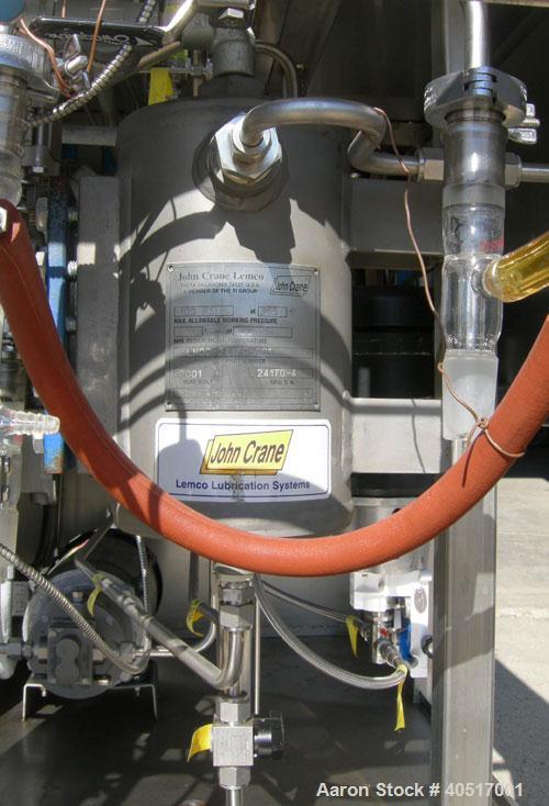 Used Artisan Single Cylinder Thin Film Evaporator, Model Protherm 50.  .5 square feet, horizontal, 316 stainless steel contact areas. 3-7/8" diameter x 13-1/2" long jacketed chamber. Internal rated F...
