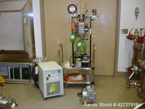 Used Pope Scientific Wiped Film Evaporator, .35 Square Feet. 2" Diameter, glass chamber, stainless steel rotor with Teflon wipers, electrically heated with heater band, glass coil condenser, receiver...