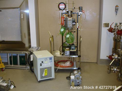 Used Pope Scientific Wiped Film Evaporator, .35 Square Feet. 2" Diameter, glass chamber, stainless steel rotor with Teflon wipers, electrically heated with heater band, glass coil condenser, receiver...
