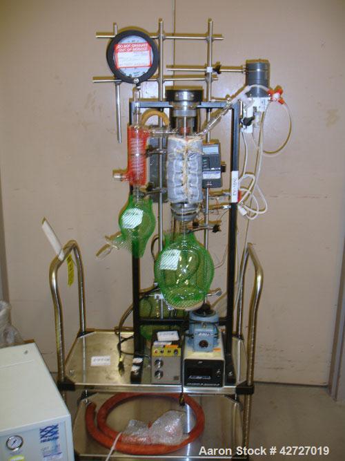 Used Pope Scientific Wiped Film Evaporator, .35 Square Feet. 2" Diameter, glass chamber, stainless steel rotor with Teflon wipers, electrically heated with heater band, glass coil condenser, receiver...
