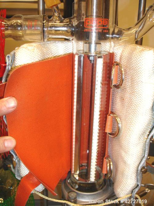 Used Pope Scientific Wiped Film Evaporator, .35 Square Feet. 2" Diameter, glass chamber, stainless steel rotor with Teflon wipers, electrically heated with heater band, glass coil condenser, receiver...
