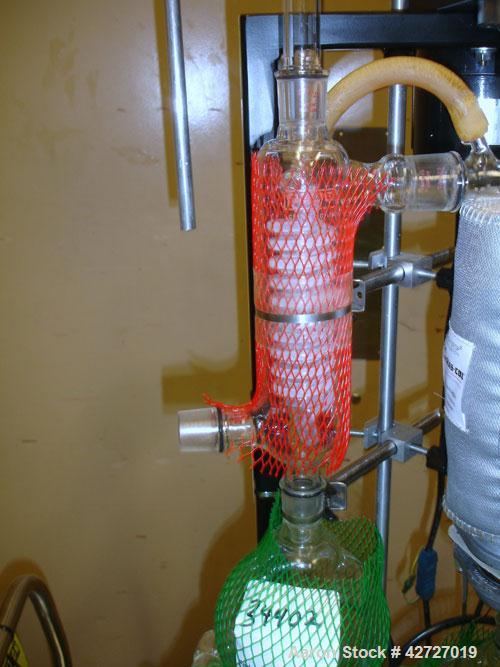 Used Pope Scientific Wiped Film Evaporator, .35 Square Feet. 2" Diameter, glass chamber, stainless steel rotor with Teflon wipers, electrically heated with heater band, glass coil condenser, receiver...
