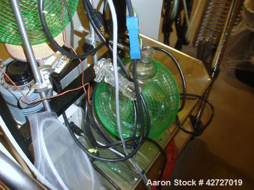 Used Pope Scientific Wiped Film Evaporator, .35 Square Feet. 2" Diameter, glass chamber, stainless steel rotor with Teflon wipers, electrically heated with heater band, glass coil condenser, receiver...