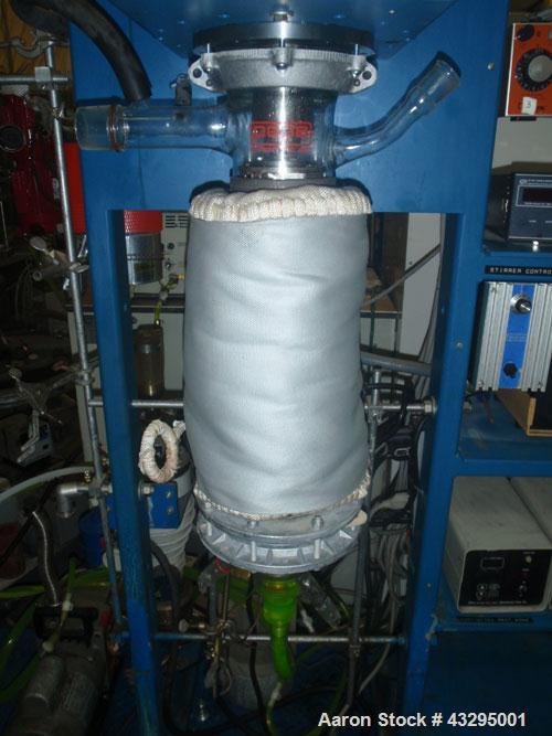 Used Pope 4" Wiped Film Evaporator. Glass and stainless steel bodies.Skid mounted system with vacuum pump.