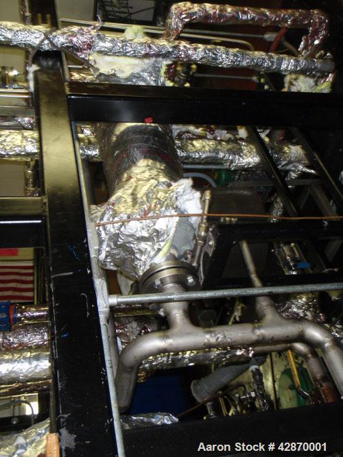 Used Pfaudler Wipe Film Evaporator. Approximately 25 square feet, 316 stainless steel, internal rated 25 psi/full vacuum @ 650 deg F, jacket rated 150 psi @ 650 deg F, 4 gpm, rated capacity 2 mm gall...