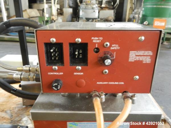 Used Pope Scientific Wiped Film Evaporator, 0.35 Square Feet. 2" Diameter glass chamber, stainless steel rotor with Teflon wipers driven by 1/12 hp dc motor with controller, glass coil condenser with...