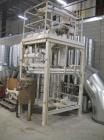 Used Luwa Thin Film Evaporator, 5.4 square feet, model LN-0050, stainless steel. Driven by a  2 hp xp motor. Includes a condenser, approximate 50 gallon stainless steel receiver tank, 20