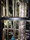 Used Pfaudler Wipe Film Evaporator. Approximately 25 square feet, 316 stainless steel, internal rated 25 psi/full vacuum @ 650 deg F, jacket rated 150 psi @ 650 deg F, 4 gpm, rated capacity 2 mm gall...