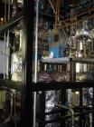 Used Pfaudler Wipe Film Evaporator. Approximately 25 square feet, 316 stainless steel, internal rated 25 psi/full vacuum @ 650 deg F, jacket rated 150 psi @ 650 deg F, 4 gpm, rated capacity 2 mm gall...
