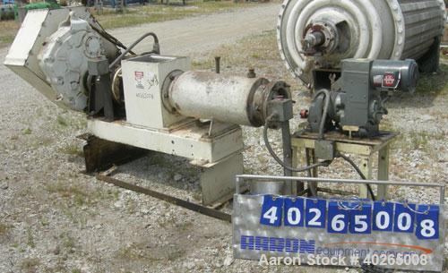 Used Bonnot extruder,  8" diameter screw (6" pitch) x 12" long jacketed barrel, carbon steel.  Top feed 8" x 12".  With conditioner screw.  Main drive 20 hp Reeves variable speed belt driven thru a D...