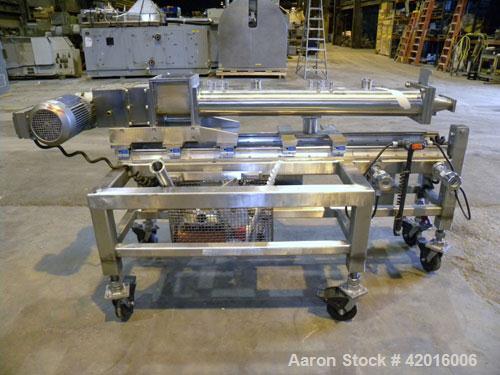 Used Twin Screw Food Extruder. (2) Approximately 4-1/2" diameter x 45" long polypropylene intermeshing screws. 316 Stainless steel non-jacketed barrel with (2) 2" and (8) 5/8" connections. 7-3/8" x 7...
