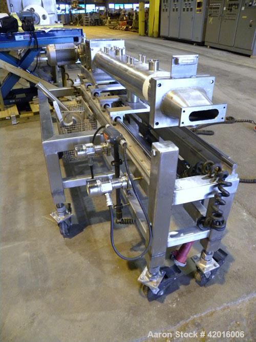 Used Twin Screw Food Extruder. (2) Approximately 4-1/2" diameter x 45" long polypropylene intermeshing screws. 316 Stainless steel non-jacketed barrel with (2) 2" and (8) 5/8" connections. 7-3/8" x 7...