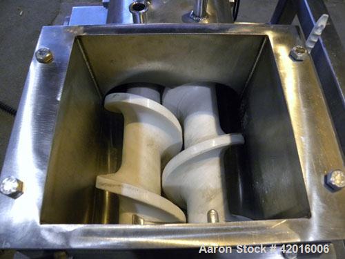 Used Twin Screw Food Extruder. (2) Approximately 4-1/2" diameter x 45" long polypropylene intermeshing screws. 316 Stainless steel non-jacketed barrel with (2) 2" and (8) 5/8" connections. 7-3/8" x 7...