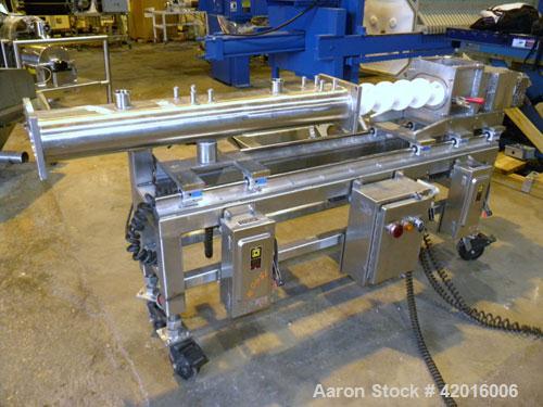 Used Twin Screw Food Extruder. (2) Approximately 4-1/2" diameter x 45" long polypropylene intermeshing screws. 316 Stainless steel non-jacketed barrel with (2) 2" and (8) 5/8" connections. 7-3/8" x 7...