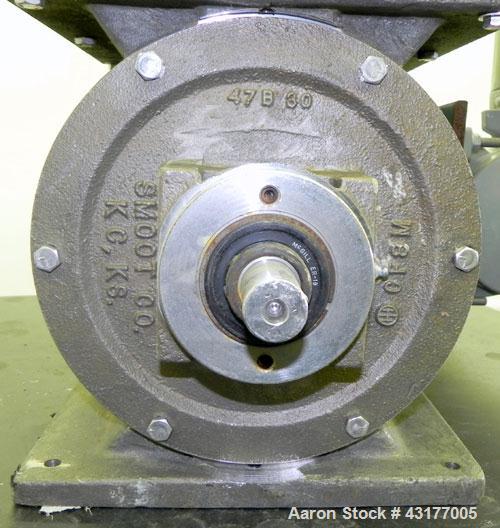 Used Smoot Type 5 Rotary Valve, Model FT9, 316 Stainless Steel. Approximately 0.27 cubic feet per revolution.  8" Diameter x 8" wide open vane 304 stainless steel rotor.  8" x  8’’ Inlet/outlet. Driv...