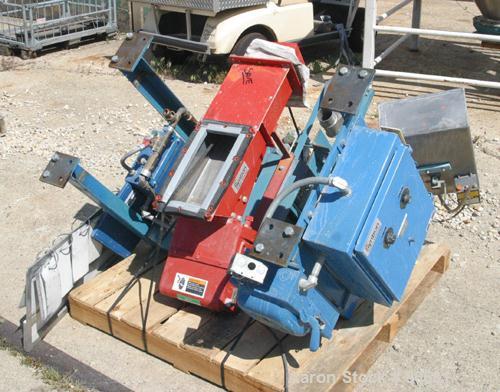USED: FMC Syntron electromagnetic vibrating feeder, model F212B, 430 stainless steel clad. 8" wide x 30" long x 4" deep trough. Top inlet end outlet. 60/460 volt. Includes controller panel.
