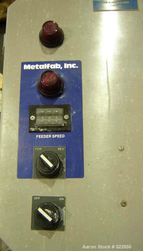 USED: 6" Metalfab screw feeder, reversing two outlet design, modelDB1-6. Carbon steel screw and tube. Has 1 hp DC motor and controller.Screw is 6" diameter. Distance from center of feed to center ofo...