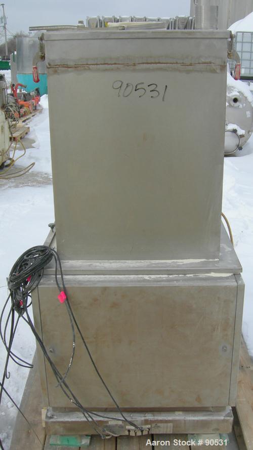 USED: Accurate Volumetric Dry Material Feeder. Approximate 3" diameter x 45" long stainless steel screw. Approximate feed rate to 300 cubic feet an hour. Vinyl hopper, capacity 2.65 cubic feet. Drive...