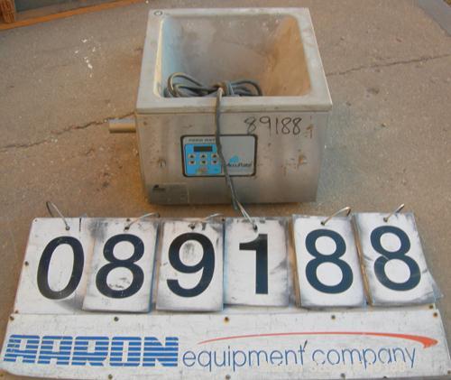 USED: Accurate volumetric dry material feeder. Approximate 1" diameterx 12" long 304 stainless steel screw, feed rate to 1.38 cubic feet anhour. Vinyl hopper, capacity .33 cubic feet. Driven by a 1/8...