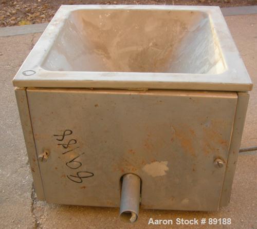 USED: Accurate volumetric dry material feeder. Approximate 1" diameterx 12" long 304 stainless steel screw, feed rate to 1.38 cubic feet anhour. Vinyl hopper, capacity .33 cubic feet. Driven by a 1/8...