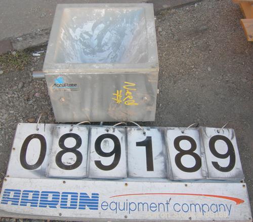 USED: Accurate volumetric dry material feeder. Approximate 1" diameter x 12" long 304 stainless steel screw, feed rate to 1.38 cubic feet an hour. Vinyl hopper, capacity .33 cubic feet. Driven by a 1...