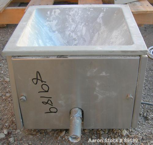 USED: Accurate volumetric dry material feeder. Approximate 1" diameter x 12" long 304 stainless steel screw, feed rate to 1.38 cubic feet an hour. Vinyl hopper, capacity .33 cubic feet. Driven by a 1...