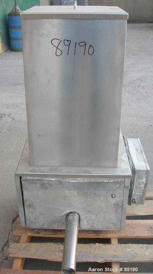USED: Accurate volumetric dry material feeder. Approximate 2" diameterx 30" long 304 stainless steel screw, feed rate to 48 cubic feet anhour. Vinyl hopper, capacity .9 cubic feet. Driven by a 1/4 hp...