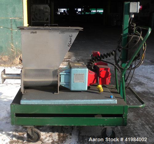Used Acrison Volumetric Dry Ingredient Feeder, model 105-E, 304 stainless steel. Feed rate to 6 cubic feet per hour. 1-3/8" diameter x 24" long metering auger, (1) intromitter, driven by a 1/2 hp, 90...
