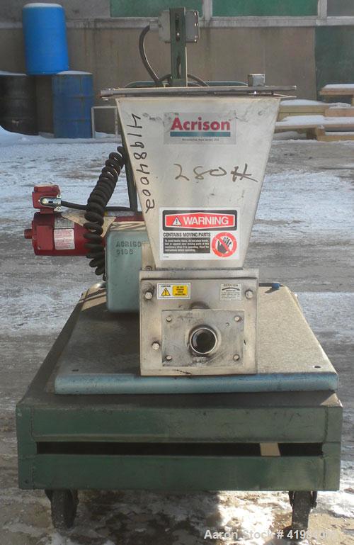 Used Acrison Volumetric Dry Ingredient Feeder, model 105-E, 304 stainless steel. Feed rate to 6 cubic feet per hour. 1-3/8" diameter x 24" long metering auger, (1) intromitter, driven by a 1/2 hp, 90...