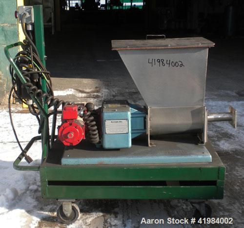 Used Acrison Volumetric Dry Ingredient Feeder, model 105-E, 304 stainless steel. Feed rate to 6 cubic feet per hour. 1-3/8" diameter x 24" long metering auger, (1) intromitter, driven by a 1/2 hp, 90...