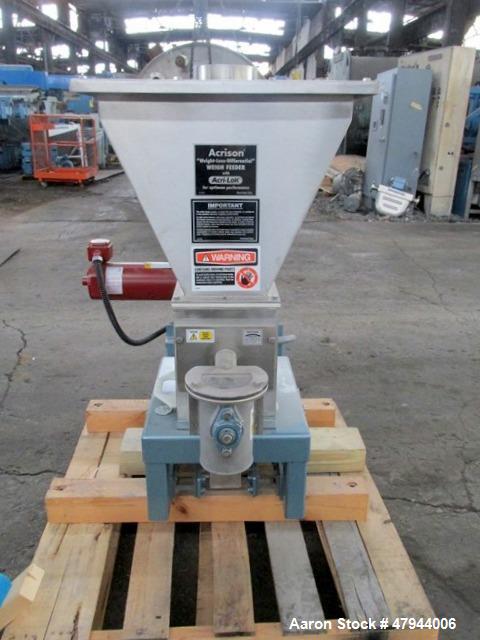 Used Acrison Loss In Weight Feeder, Model 407-200-100-101-0-00. Stainless steel construction, approximately 2" diameter x 9' long screw, 0.5hp DC motor with control panel. Serial #04589-02.