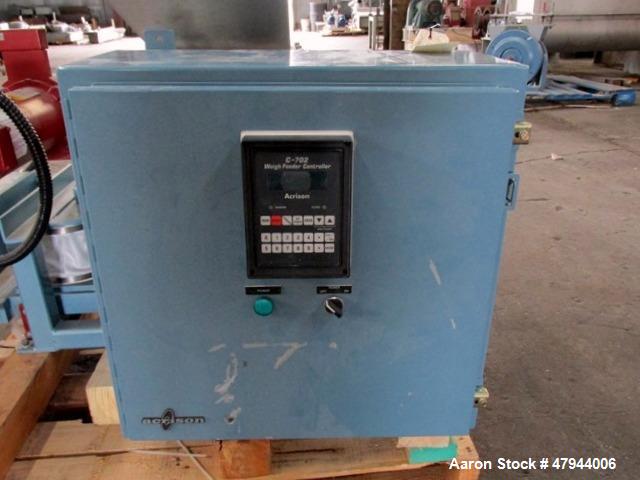 Used Acrison Loss In Weight Feeder, Model 407-200-100-101-0-00. Stainless steel construction, approximately 2" diameter x 9' long screw, 0.5hp DC motor with control panel. Serial #04589-02.