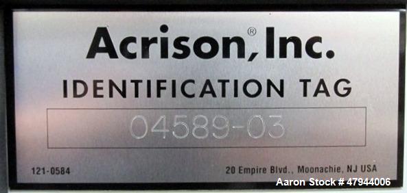 Used Acrison Loss In Weight Feeder, Model 407-200-100-101-0-00. Stainless steel construction, approximately 2" diameter x 9' long screw, 0.5hp DC motor with control panel. Serial #04589-02.