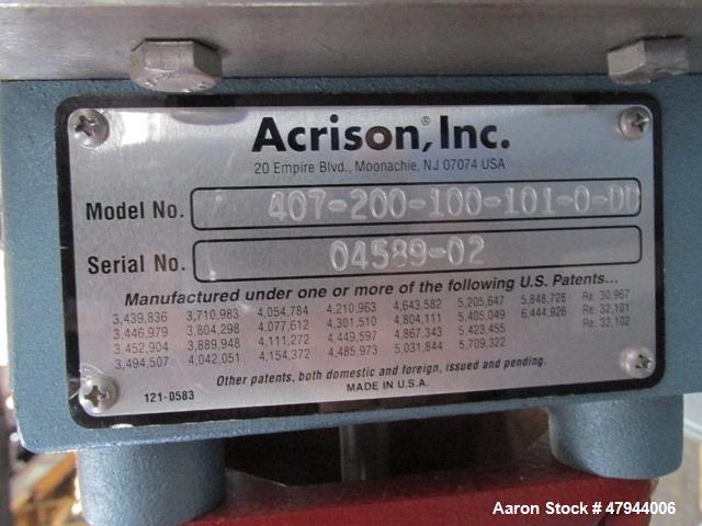 Used Acrison Loss In Weight Feeder, Model 407-200-100-101-0-00. Stainless steel construction, approximately 2" diameter x 9' long screw, 0.5hp DC motor with control panel. Serial #04589-02.
