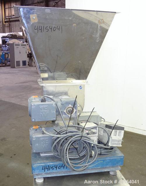 Used Brabender Technologie Twin Screw Feeder, Model DDSR40/60, 304 Stainless Steel. (2) Approximate 2" diameter x 15" long screws, driven by a 1/2hp, 3/60/230/460 volt, 1700 rpm gear motor. Feed hopp...