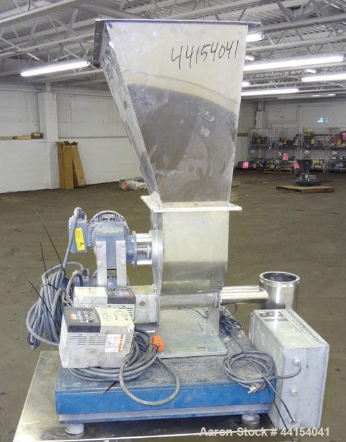 Used Brabender Technologie Twin Screw Feeder, Model DDSR40/60, 304 Stainless Steel. (2) Approximate 2" diameter x 15" long screws, driven by a 1/2hp, 3/60/230/460 volt, 1700 rpm gear motor. Feed hopp...