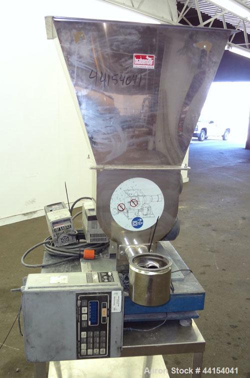 Used Brabender Technologie Twin Screw Feeder, Model DDSR40/60, 304 Stainless Steel. (2) Approximate 2" diameter x 15" long screws, driven by a 1/2hp, 3/60/230/460 volt, 1700 rpm gear motor. Feed hopp...