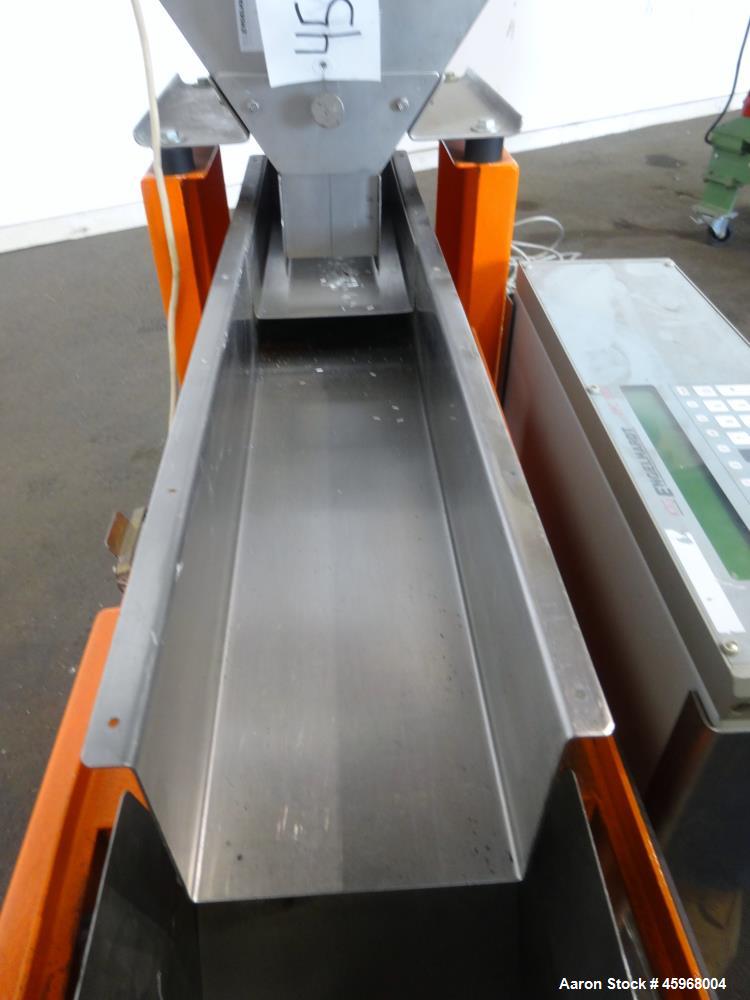 Used Engelhardt Continuous Dosing Weigher, Type KDE-GL 800E. Consists of top feed hopper, vibratory feeder with cover, weighing system, bottom discharge vibratory feeder. Has Engelhardt model DPC3000...