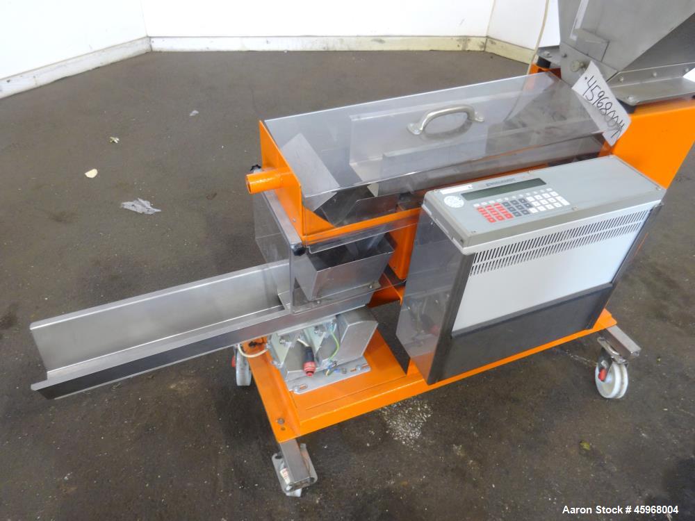 Used Engelhardt Continuous Dosing Weigher, Type KDE-GL 800E. Consists of top feed hopper, vibratory feeder with cover, weighing system, bottom discharge vibratory feeder. Has Engelhardt model DPC3000...