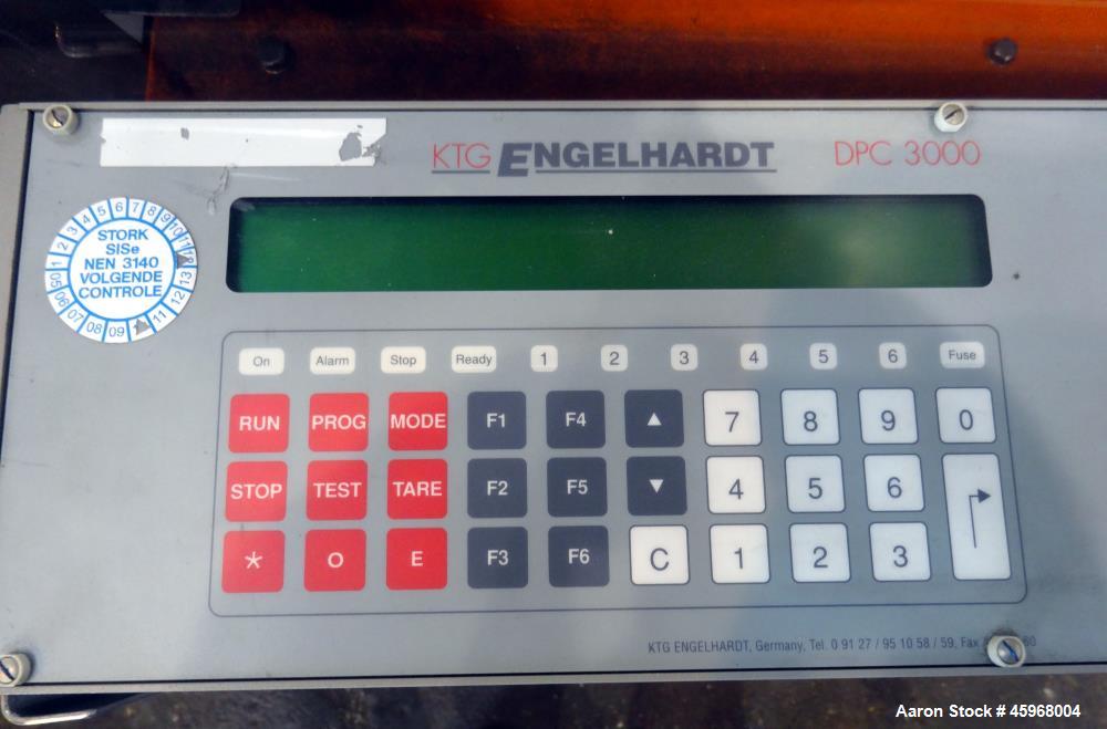 Used Engelhardt Continuous Dosing Weigher, Type KDE-GL 800E. Consists of top feed hopper, vibratory feeder with cover, weighing system, bottom discharge vibratory feeder. Has Engelhardt model DPC3000...