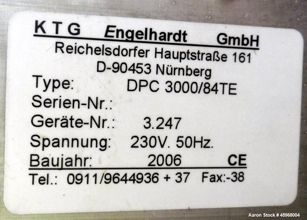 Used Engelhardt Continuous Dosing Weigher, Type KDE-GL 800E. Consists of top feed hopper, vibratory feeder with cover, weighing system, bottom discharge vibratory feeder. Has Engelhardt model DPC3000...
