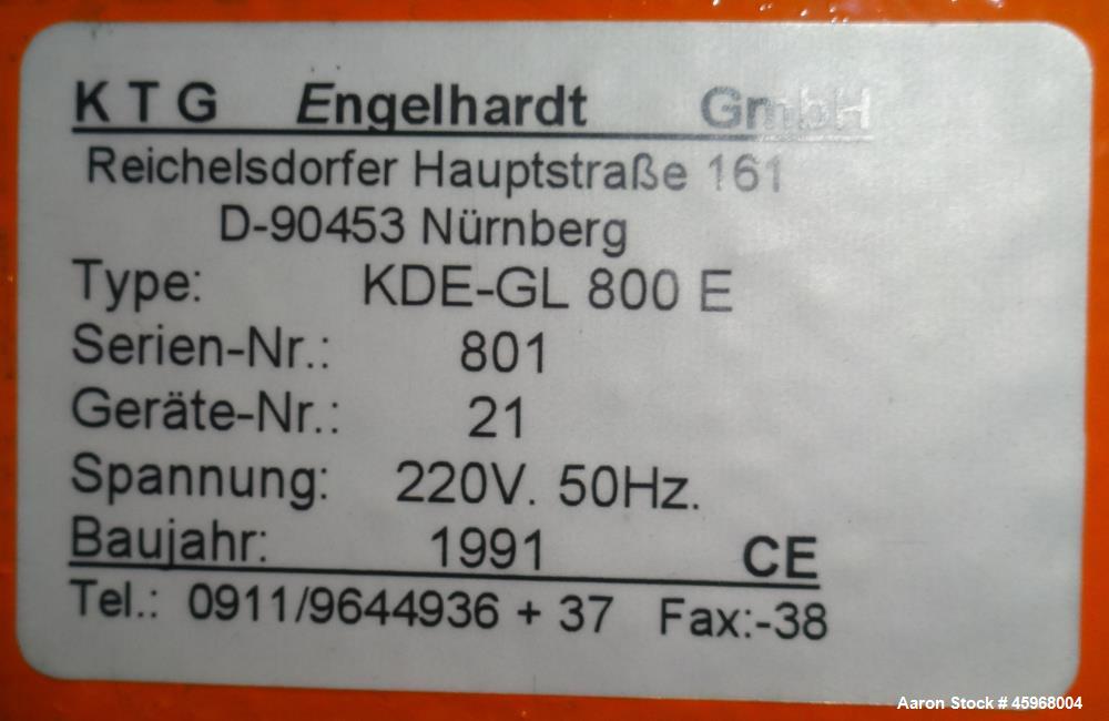 Used Engelhardt Continuous Dosing Weigher, Type KDE-GL 800E. Consists of top feed hopper, vibratory feeder with cover, weighing system, bottom discharge vibratory feeder. Has Engelhardt model DPC3000...