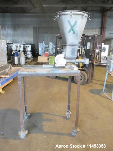Used K-Tron Feeder, Model F-1. 2" diameter x 24" long screw. Stainless steel construction. Mounted on a carbon steel cart 52" high. 0.5 HP drive, DC, 97 RPM screw.