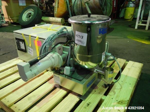 Used Ktron Gravimetric Feeder, Model F-1. Stainless steel construction, twin screw with agitated feed hopper, scale rated 24KG, 11KG net, 13KG tare, .132 HP motor, with controller, serial# 4501074067.