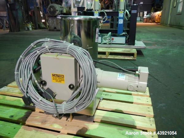 Used Ktron Gravimetric Feeder, Model F-1. Stainless steel construction, twin screw with agitated feed hopper, scale rated 24KG, 11KG net, 13KG tare, .132 HP motor, with controller, serial# 4501074067.