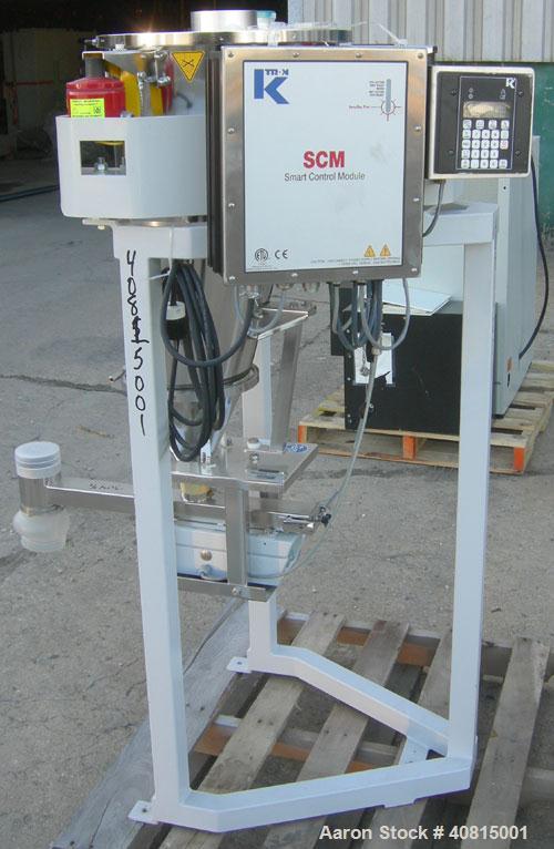 Used K-Tron Vibratory Feeder, Model K2MLKV2, 304 Stainless Steel.  Rated approximately 100 pounds per hour.  Includes a top mounted 316 stainless steel hopper and a Smart Control Module with keypad.