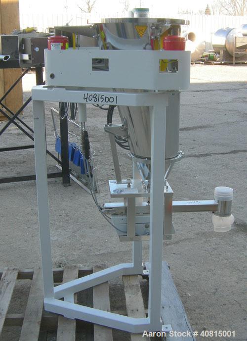 Used K-Tron Vibratory Feeder, Model K2MLKV2, 304 Stainless Steel.  Rated approximately 100 pounds per hour.  Includes a top mounted 316 stainless steel hopper and a Smart Control Module with keypad.