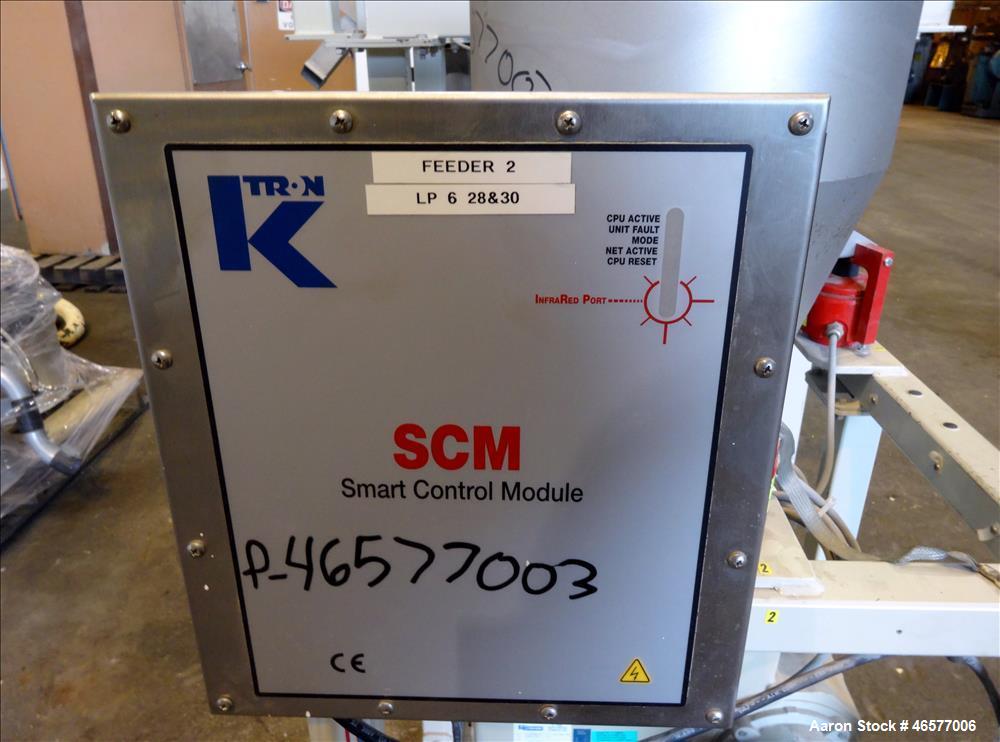 Used Feeder System Consisting of  (1) K-Tron feeder model K2MLS rated for 300 pounds per hour driven by a 0.45 kw, 200 volt, 2000 rpm motor (1) K-Tron feeder model K2MLT20 rated for 20 pounds per hou...